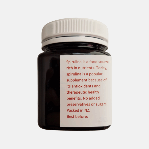 Organic spirulina capsules and tablets in bottle - plant-based protein for energy & immunity