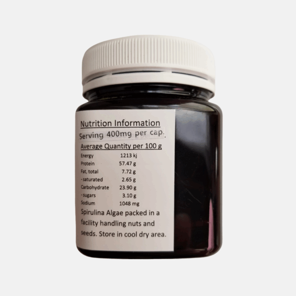 Organic spirulina capsules and tablets in bottle - plant-based protein for energy & immunity