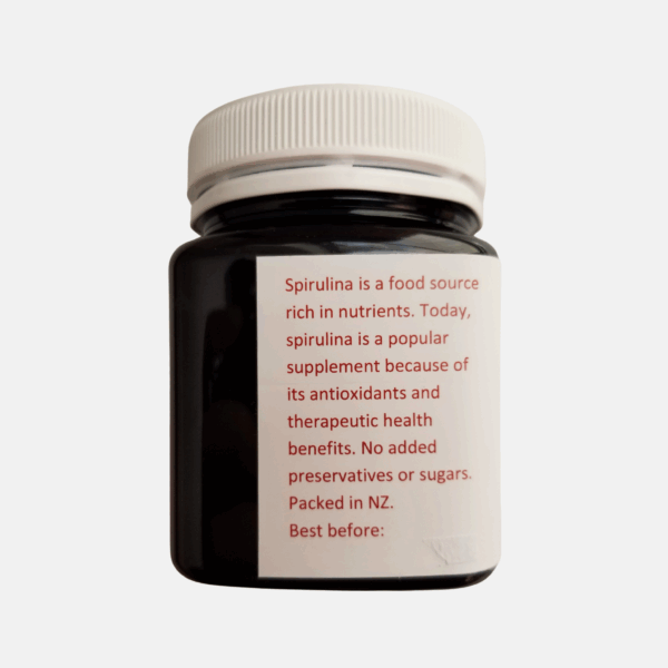 Organic spirulina capsules and tablets in bottle - plant-based protein for energy & immunity