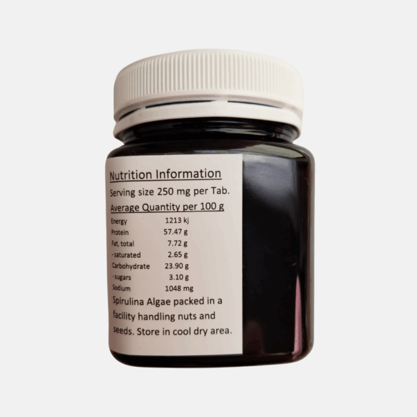 Organic spirulina capsules and tablets in bottle - plant-based protein for energy & immunity